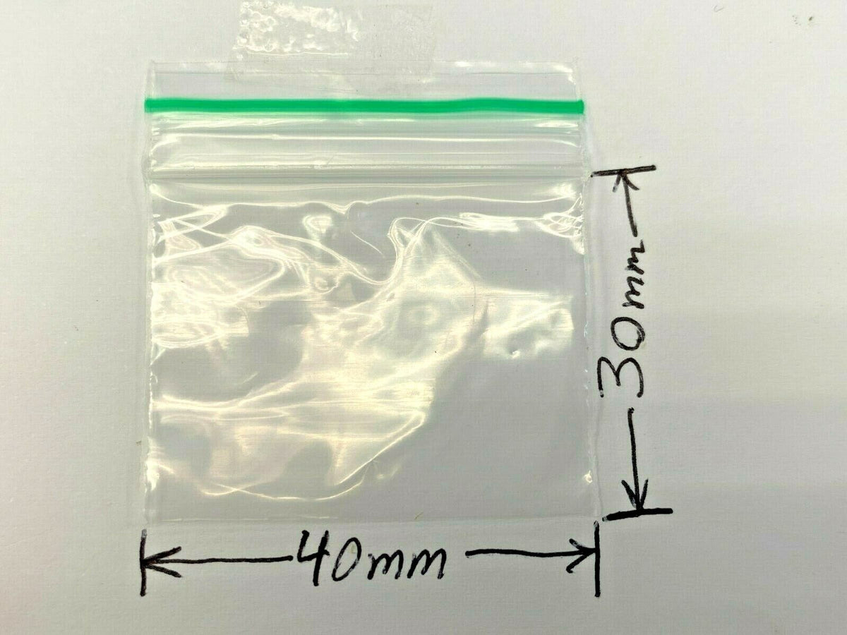 A clear plastic zip-top bag with a green seal line, shown on a white background with dimension arrows and labels indicating 40mm width and 30mm height.