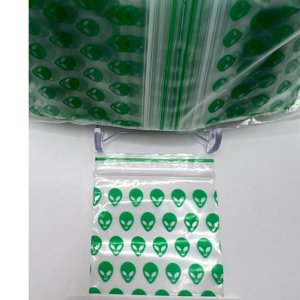 Close-up of Green Alien design on a 50x50mm (2x2 inch) poly baggie