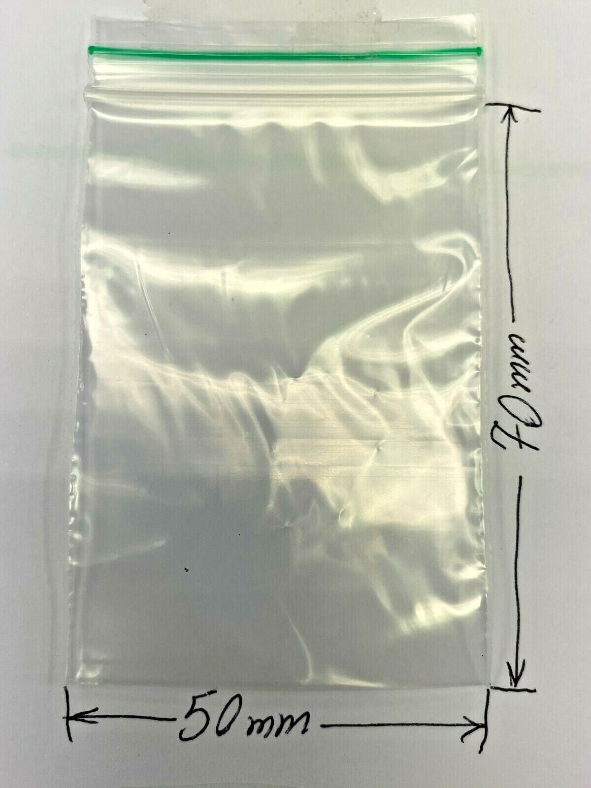 A clear plastic zip-top bag with a green seal line, shown on a white background with dimension markers indicating 70 mm height and 50 mm width.